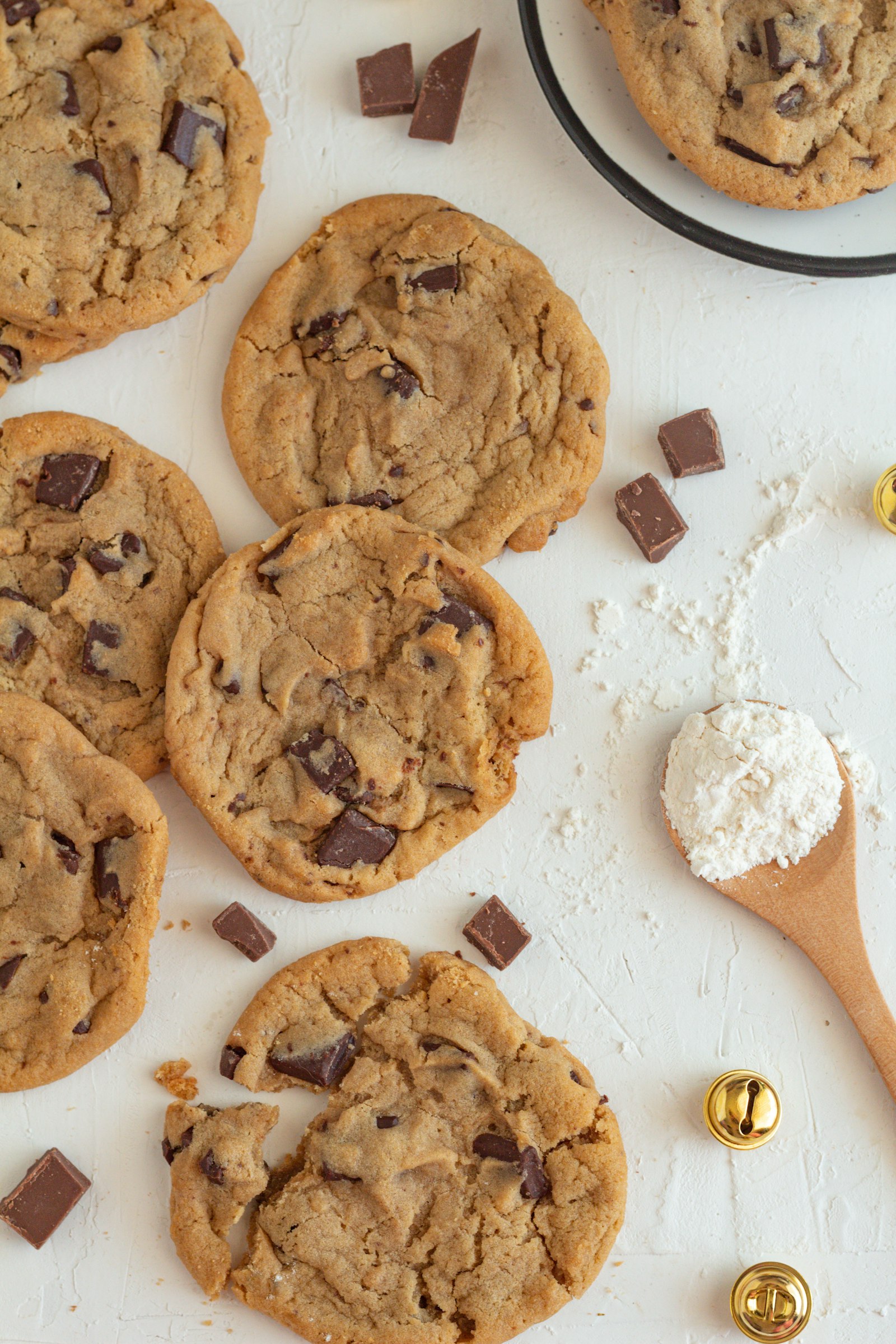 Cookies with a wooden spoon and flour